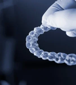 The dentist at Banyule Dental holds the Invisalign