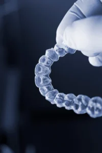 The dentist at Banyule Dental holds the Invisalign